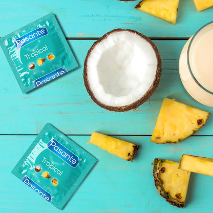 Pasante Tropical condoms with coconut, pineapple, and smoothie on a turquoise background